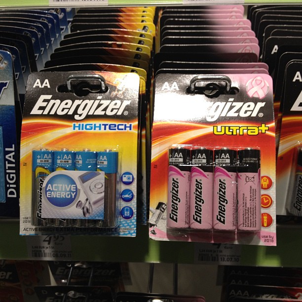 Two packs of batteries side by side. One blue, one pink